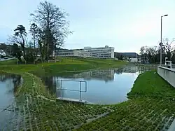 The same pond, full of the water it is detaining, during a flood.