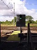 The red and green stop light at an MWL foot crossing near Offord Cluny, Cambridgeshire. This is a major crossing across the high speed East Coast Main Line