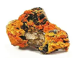 Francevillite (orange) with Curienite (yellow) and Chervetite, Mounana Mine, Franceville, Haut-Ogooué Province, Gabon. Overall size 8.7 x 6.1 x 2.1&nbsp;cm.