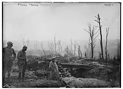 Photograph of French soldiers waiting in a trench.