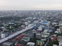 Aerial view of a highway under construction through an urban area
