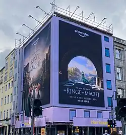 Picture of a building with large marketing posters on it