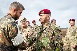 Standard combat uniform in the Disruptive Pattern Material camouflage pattern.