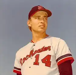 Player with white uniform and a hat with a "R" insignia