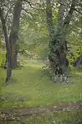Parkland with Sitting Man and Dog (1890)