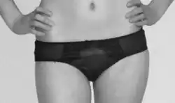 Woman wearing black hipster underwear.