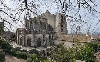 Rear. The Charlemagne bell tower, dating to the 11th century, can be seen along the right side of the cathedral.