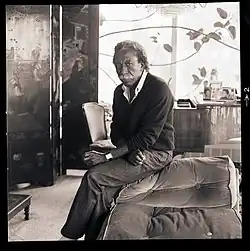 Gordon Parks next to his piano, late 1980s