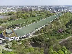 Artificial hill in Szczęśliwice Park, with a ski slope