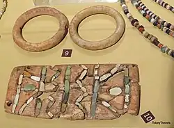 Grave Goods, Stone Plaque and Belt Buckles, Boncuklu Tarla, Ilisu Dam, Mardin Museum, Turkey.