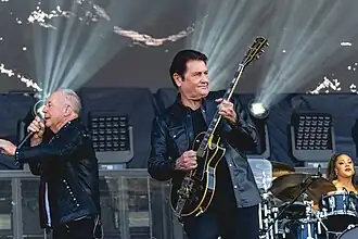 Simple Minds performing at the Isle of Wight Festival 2024. Left to right: Jim Kerr, Charlie Burchill, Cherisse Osei