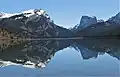 White Rock (left), Squaretop Mountain (right) reflected in Green River Lakes. White Rock is a dolomite and limestone cliff that rises 3,300 feet above the lake.