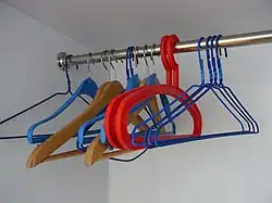 Clothes hangers with a top hook to hang onto a crossbar or a clothesline