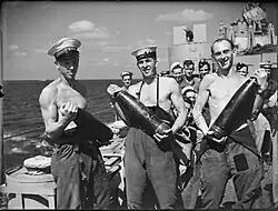 Crew of HMS&nbsp;Euryalus with shells, August 1942