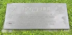 Flat black granite marker inscriber with information of Dowell and his wife