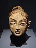 Head of a female, Ajina Tepe, Tajikistan, end of 7th century, early 8th century CE, National Museum of Antiquities of Tajikistan.[4]