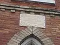 Marble plaque with the original denomination of the church and its year of construction. "M.E." stands for Methodist Episcopal.[2]
