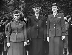 Black and white photograph of three women in military dress.
