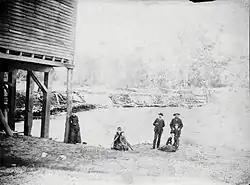 The mill and dam on the Salt Fork at Homer Illinois. This photo of the Coffeen family was taken in the mid-1880s.