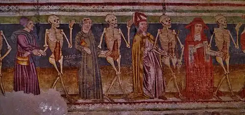 A mural depicting a cardinal, a bishop, a monk and a peasant dancing with skeletons