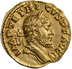 The obverse of a golden coin showing the face of Tetricus.