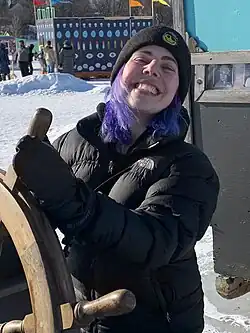 Coldwater, wearing a black parka and beanie hat