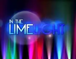 An image of spotlights with different colors, over a black background. The show title is displayed on the middle of the image.