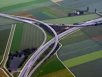 Two level semi-directional T interchange in Orbe, Switzerland. 46°43′42″N 6°34′11″E﻿ / ﻿46.72836°N 6.569738°E﻿ / 46.72836; 6.569738