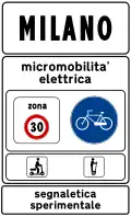 Town sign: start of urban area where electric micromobility is being experimented (50&nbsp;km/h speed limit, no use of horn and particular caution to cyclists and motorized scooters)[9]