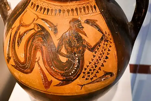 Triton, with a fishtail, holding a dolphin