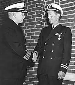 Lt. John F. Kennedy, USNR, is awarded the Navy and Marine Corps medal for "...extremely heroic conduct as Commanding Officer of Motor Torpedo Boat 109...". The Medal was presented to John F. Kennedy by Captain Frederick L. Conklin, Commandant of the Chelsea Naval Hospital, at the hospital in Massachusetts for Kennedy's heroics in the rescue of the crew of PT 109 during WWII on August 2, 1943 when the motor torpedo boat was struck by a Japanese destroyer.