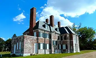 A large brick mansion, photographed in color in 2012