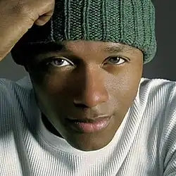 The cover features Javier Colon wearing a white shirt and a green toque.