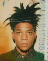 Headshot of Basquiat on a white background, overlaid with text and discoloration effects