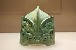 Shang dynasty bronze helmet with Taotie motif.