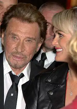Hallyday with his fourth and last wife, Læticia Boudou, at the Mamers premiere of Salaud, on t'aime in 2014.