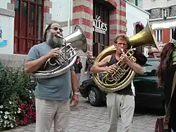 Two musicians playing helicons.