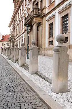 Stylized figural columns in front of the Tuscany palace, Prague (1994–1998)