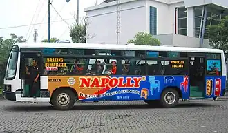 The appearance of a regular city bus owned by PO Rodta route D with a body covered with an advertising sticker for a furniture product, May 25, 2013.