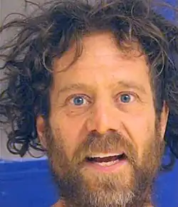 Neal Tehama County headshot, straight on, with wild eyes, wild hair, and wild beard.