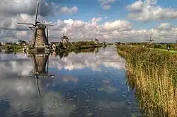 Kinderdijk windmills mirrored at the channel