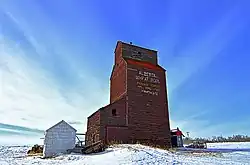 Former Kingman Alberta Wheat Pool elevator. Now located on a private farm south of Kingman.