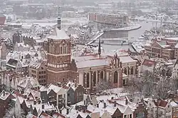 Winter view of the church and its surrounding, including riverside.