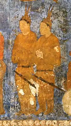 Goguryeo ambassadors[13] during an audience with king Varkhuman of Samarkand. They are identified by the two feathers on top of their head.[14] 648-651 CE, Afrasiyab, Samarkand.[4][15]