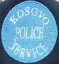 Former cap badge of the Kosovo Police Service[25]