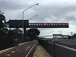 Large metal gantry with LED speed limit signs