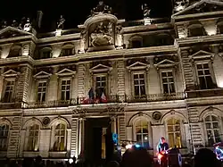 The city hall illuminated at night