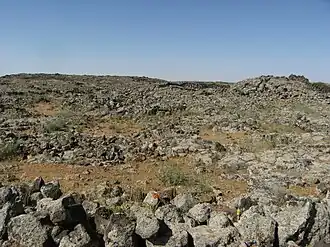 The landscape of the Lajat (pictured) largely consists of gray, volcanic rock with scattered patches of arable land