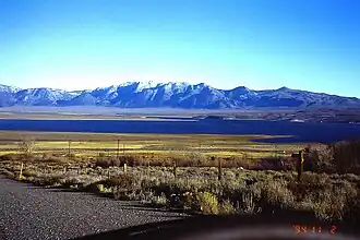 Mono County, CA: Crowley Lake and Glass Mountain Ridge, southwest view; Glass Mountain: highest peak (3395 m) in centre left; November 1994