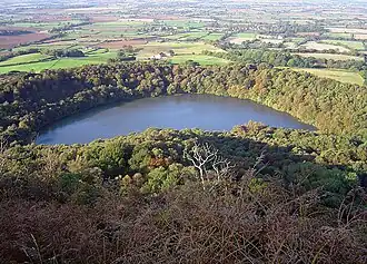 Image looking down of a lake surrounded by trees